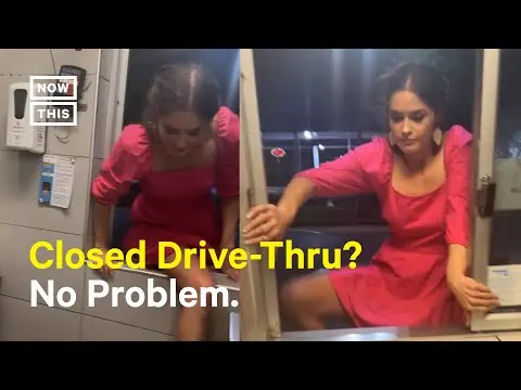 viral video woman climbing window